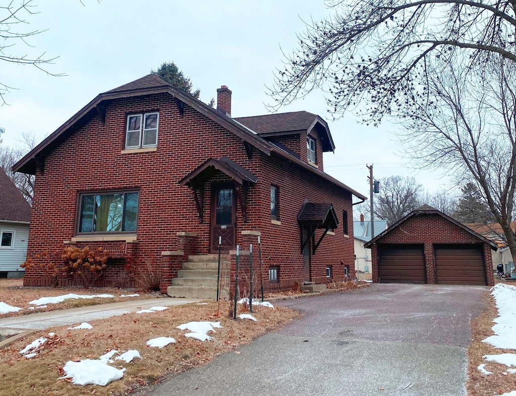 view of front facade with a garage and an outdoor structure