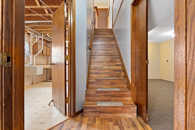 staircase featuring sink