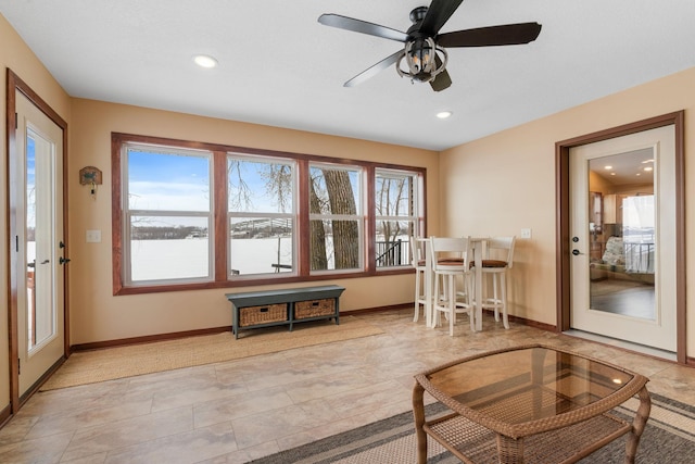 interior space featuring ceiling fan