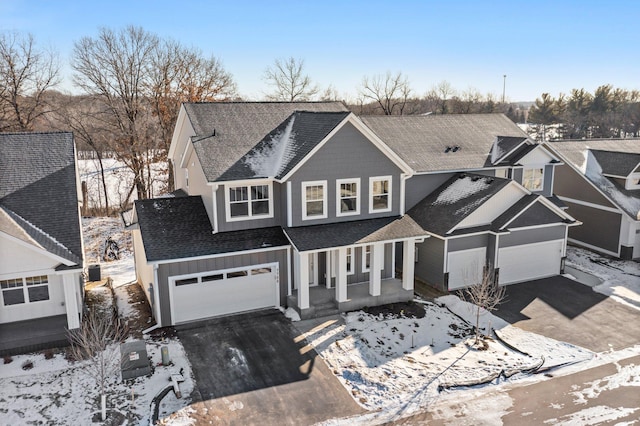 view of front of house featuring a garage and covered porch