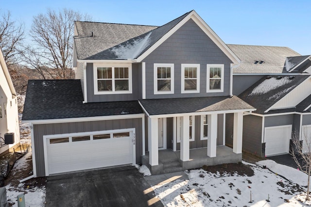 view of front facade featuring a garage and a porch