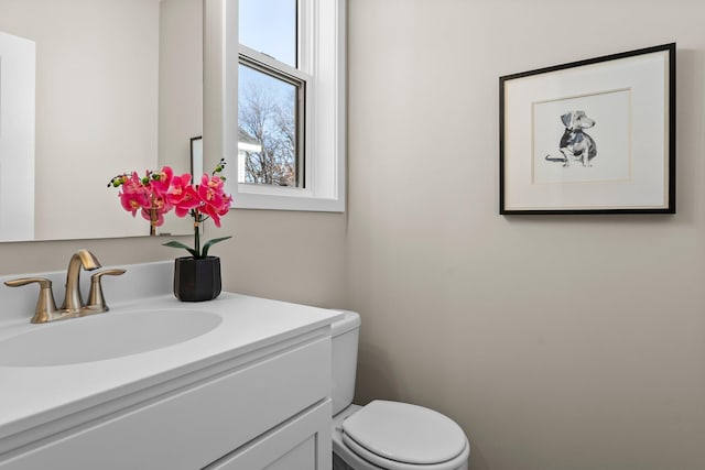 bathroom with vanity and toilet