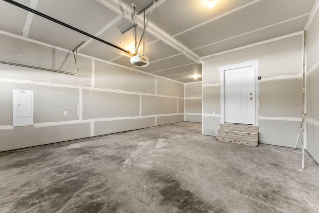 garage featuring a garage door opener and electric panel