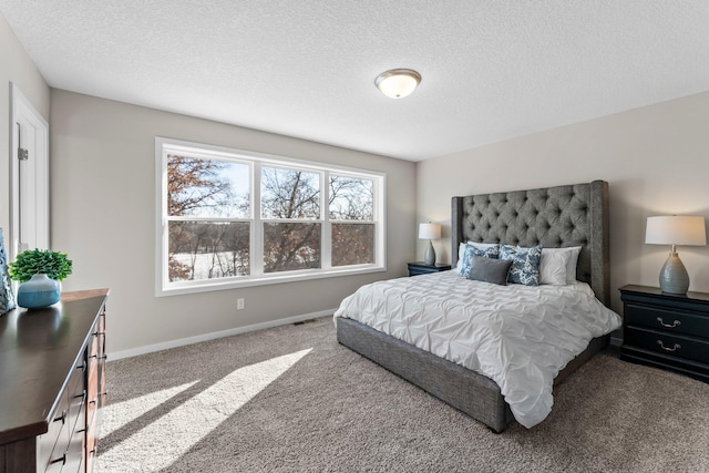 carpeted bedroom with a textured ceiling