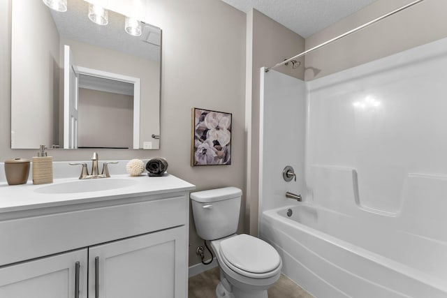 full bathroom featuring vanity, toilet, shower / bathing tub combination, and a textured ceiling