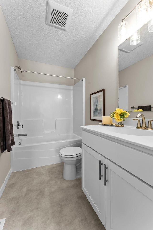 full bathroom featuring vanity,  shower combination, a textured ceiling, and toilet