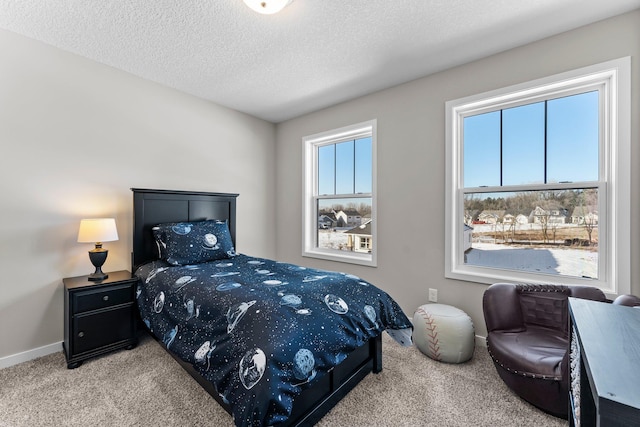 carpeted bedroom with a textured ceiling