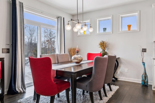 dining space with dark hardwood / wood-style floors