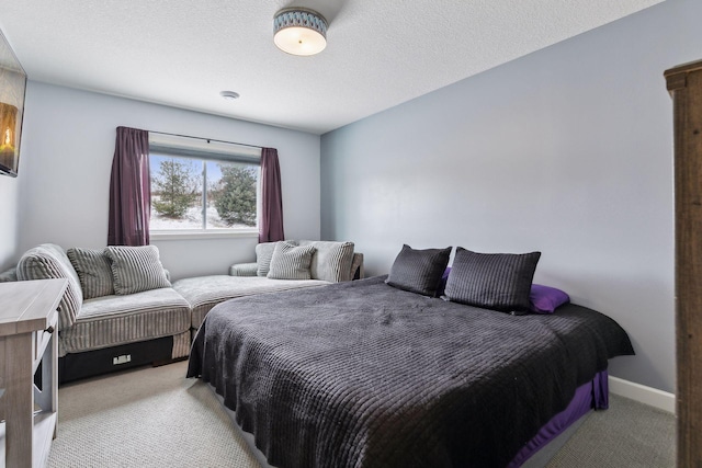 carpeted bedroom with a textured ceiling