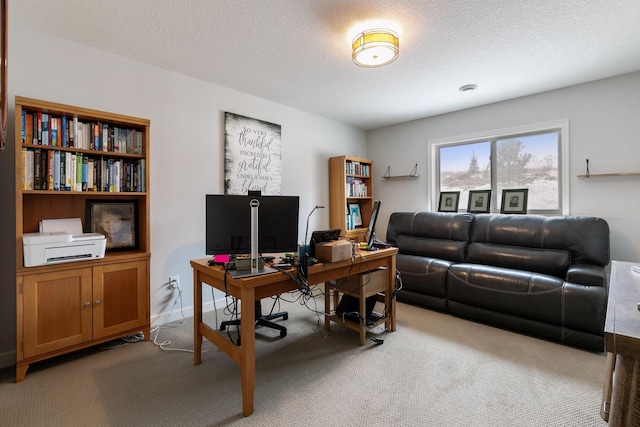 office area with light carpet and a textured ceiling