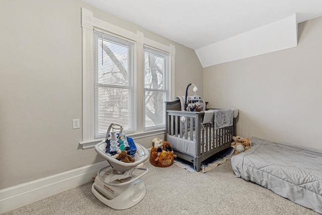 bedroom featuring carpet floors, multiple windows, and lofted ceiling