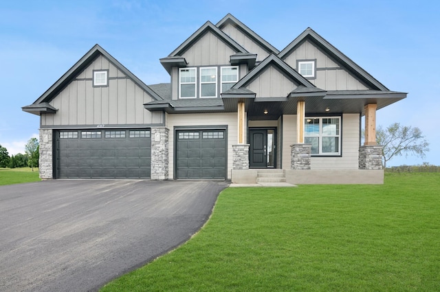 craftsman-style house with a garage and a front lawn