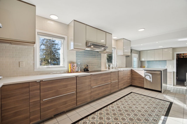 kitchen with tasteful backsplash, dishwasher, light tile patterned floors, and black electric cooktop