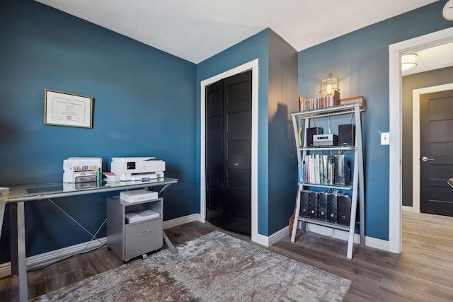 home office with hardwood / wood-style flooring