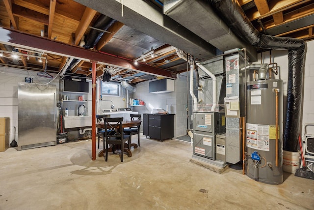 basement featuring high end fridge, sink, heating unit, and water heater