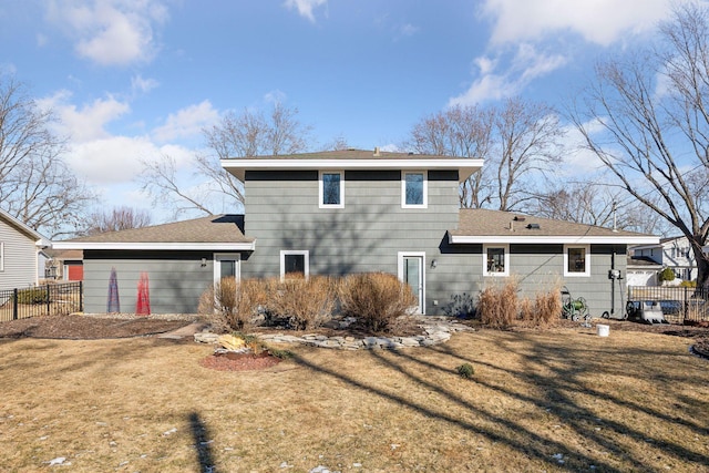 back of property featuring a lawn