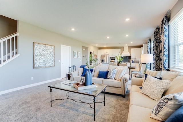 carpeted living room with plenty of natural light