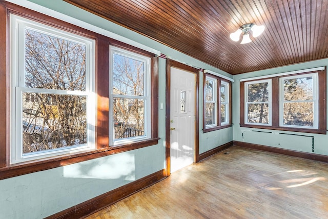 interior space featuring wood ceiling and a wealth of natural light