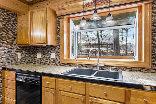 kitchen with backsplash, sink, hanging light fixtures, and black dishwasher