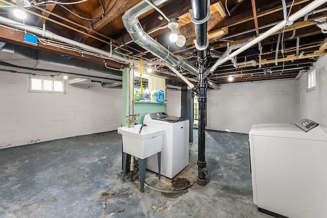 basement featuring sink and washing machine and dryer