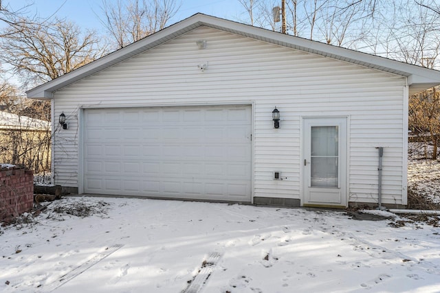 view of snow covered garage