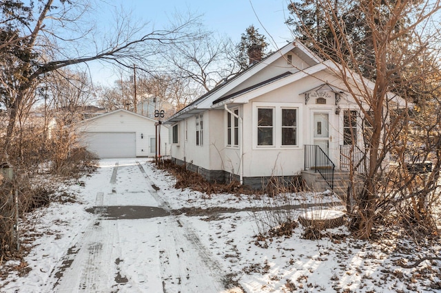 view of front of home with an outdoor structure and a garage