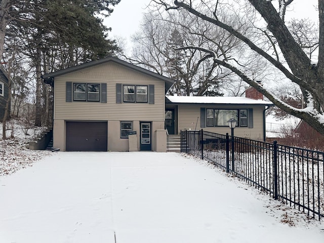 split level home featuring a garage