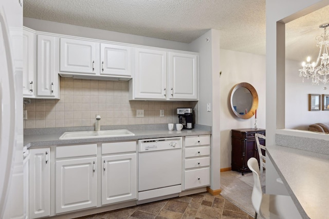 kitchen featuring sink, white appliances, white cabinetry, backsplash, and a textured ceiling