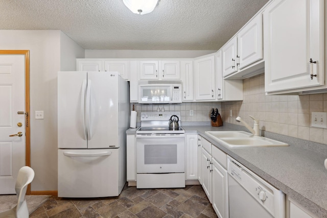 kitchen featuring sink, white cabinetry, a textured ceiling, white appliances, and backsplash