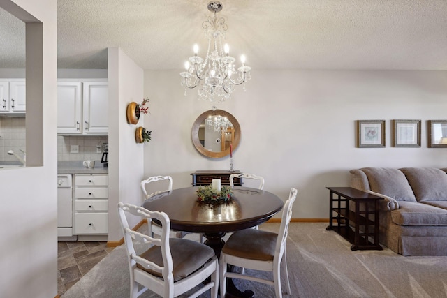 dining area featuring a textured ceiling