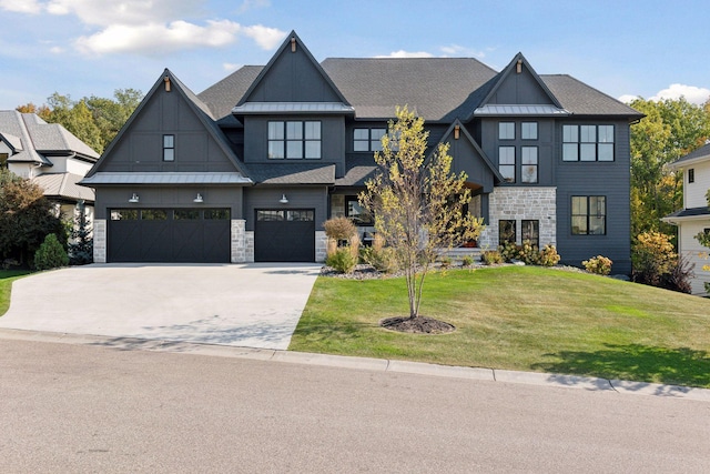 view of front facade featuring a garage and a front lawn