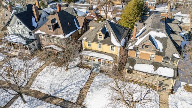 snowy aerial view featuring a residential view