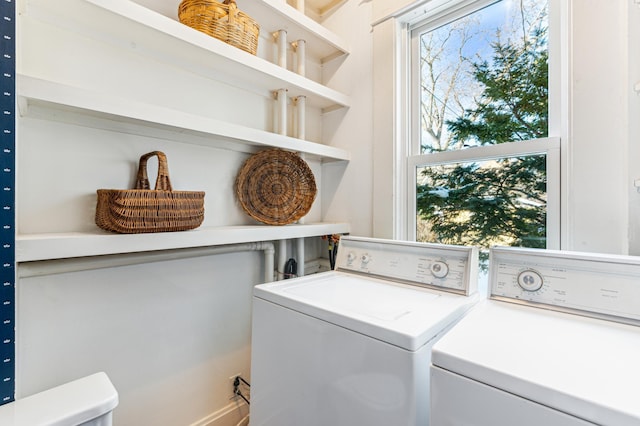 laundry room featuring independent washer and dryer and laundry area