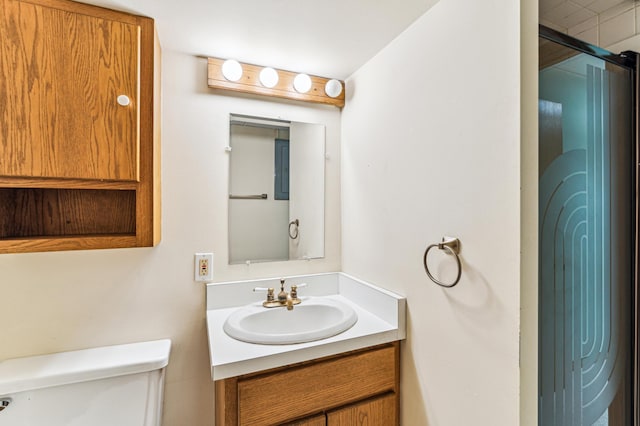 bathroom featuring toilet and vanity