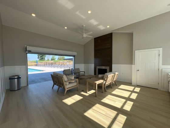 living room with lofted ceiling, ceiling fan, a fireplace, and dark hardwood / wood-style flooring