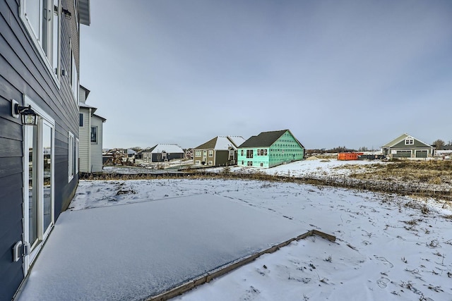 view of yard covered in snow