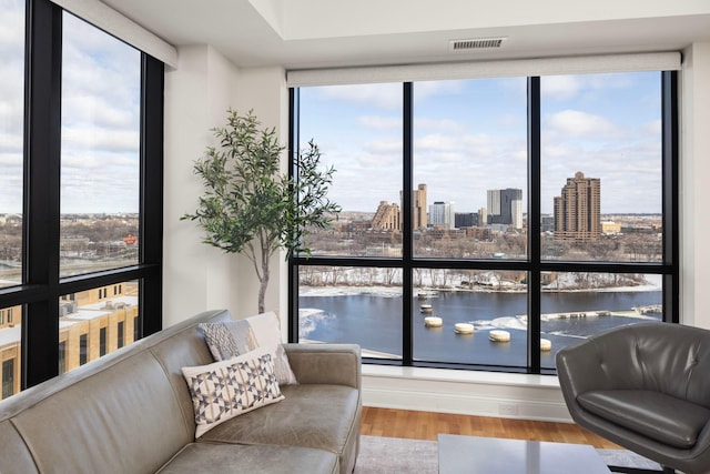 interior space with a water view and a wealth of natural light