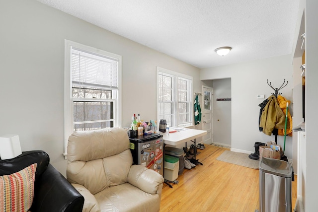 office space with hardwood / wood-style floors and a textured ceiling