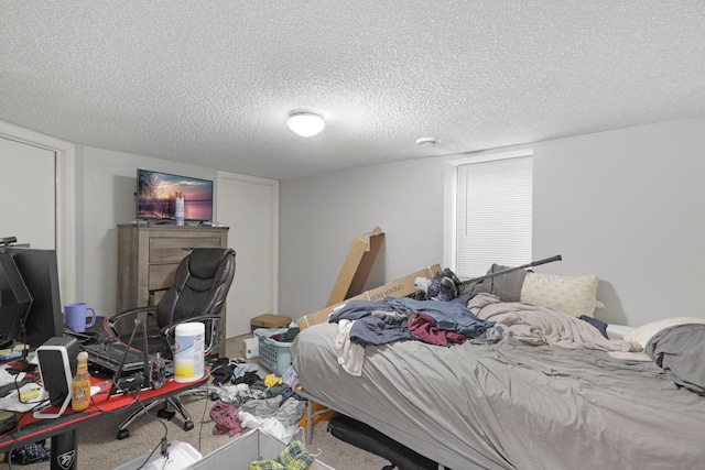 carpeted bedroom featuring a textured ceiling