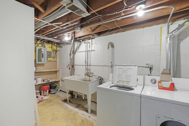 washroom with electric panel and independent washer and dryer