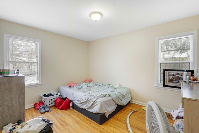 bedroom with hardwood / wood-style floors