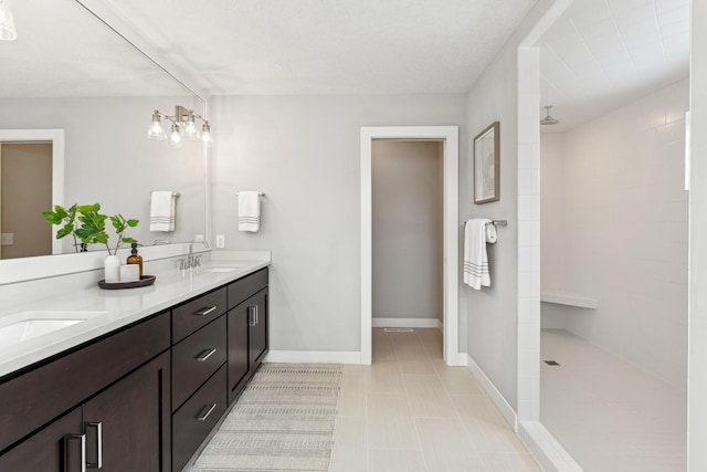 bathroom with vanity and a shower