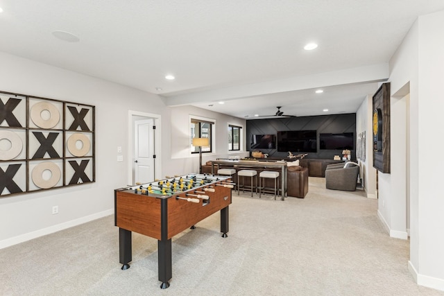 rec room featuring light colored carpet and ceiling fan