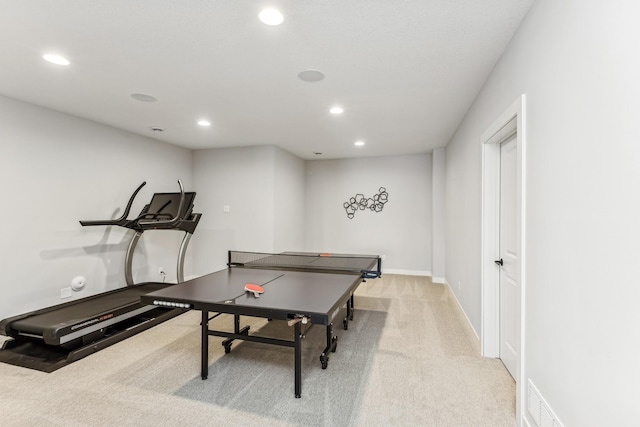 recreation room featuring light colored carpet