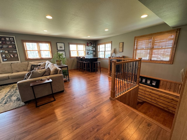 310 7th St SW, Roseau, MN 56751 - living area with a textured ceiling, recessed lighting, and wood-type flooring