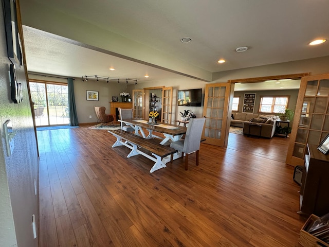 310 7th St SW, Roseau, MN 56751 - living area with recessed lighting, wood finished floors, a wealth of natural light, and french doors