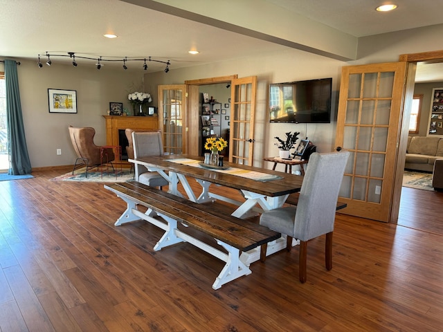 310 7th St SW, Roseau, MN 56751 - dining area with french doors, a healthy amount of sunlight, and hardwood / wood-style flooring