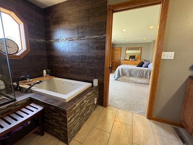 310 7th St SW, Roseau, MN 56751 - ensuite bathroom with a whirlpool tub, visible vents, tile patterned floors, and ensuite bathroom
