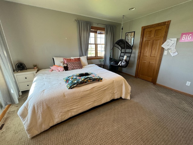 310 7th St SW, Roseau, MN 56751 - bedroom with visible vents, carpet flooring, and baseboards