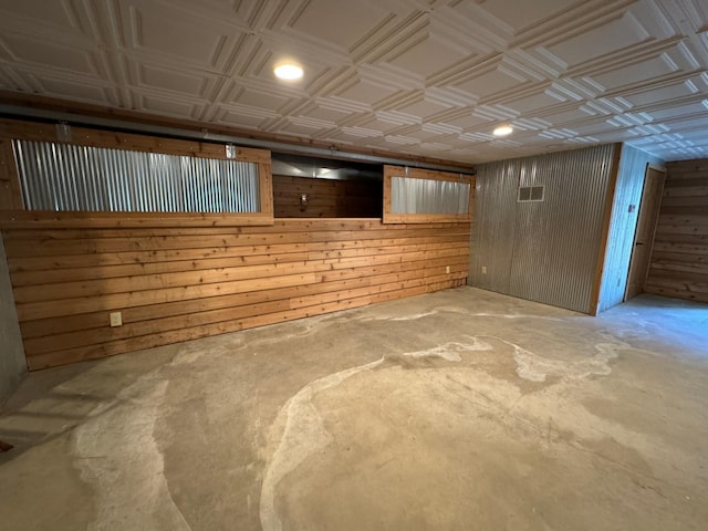 310 7th St SW, Roseau, MN 56751 - finished below grade area featuring visible vents, wood walls, recessed lighting, and an ornate ceiling